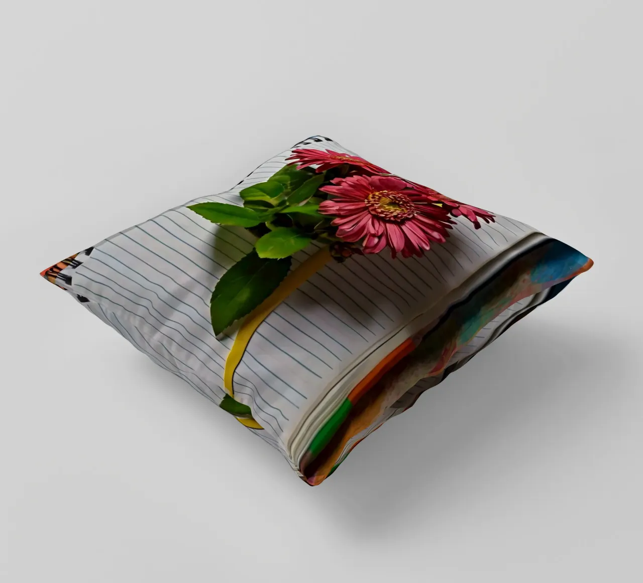 Een levendig notitieboek met roze bloemen erop, met daarop kussen van DesignDoodle