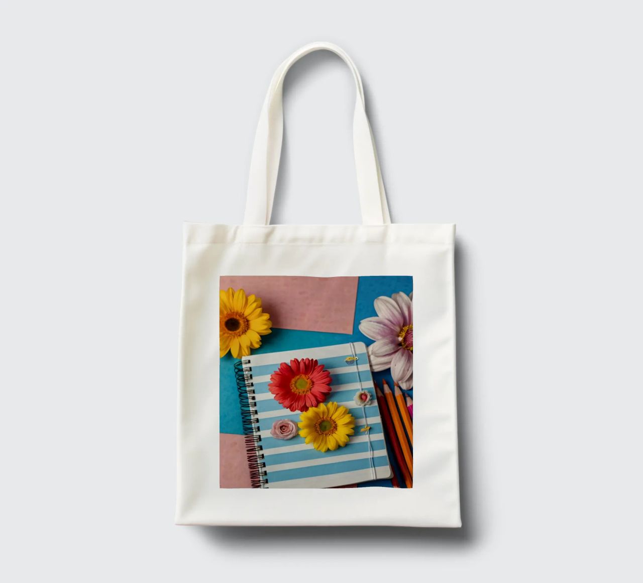 Taccuino colorato ornato di fiori e circondato da matite borsa in juta da DesignDoodle