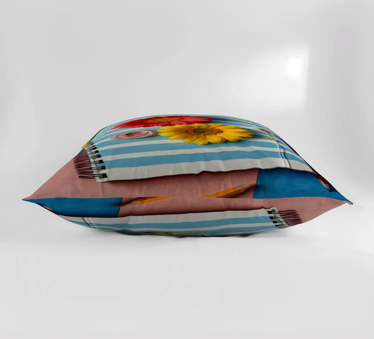 Kleurrijk notitieboekje versierd met bloemen omringd door potloden kussen van DesignDoodle
