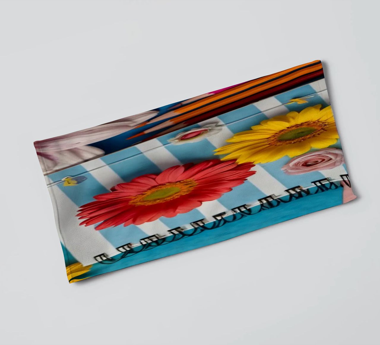Colorful notebook adorned with flowers surrounded by pencils towel by DesignDoodle