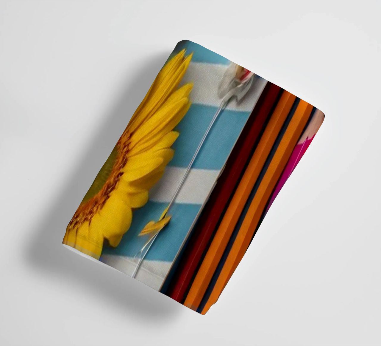 Colorful notebook adorned with flowers surrounded by pencils towel by DesignDoodle