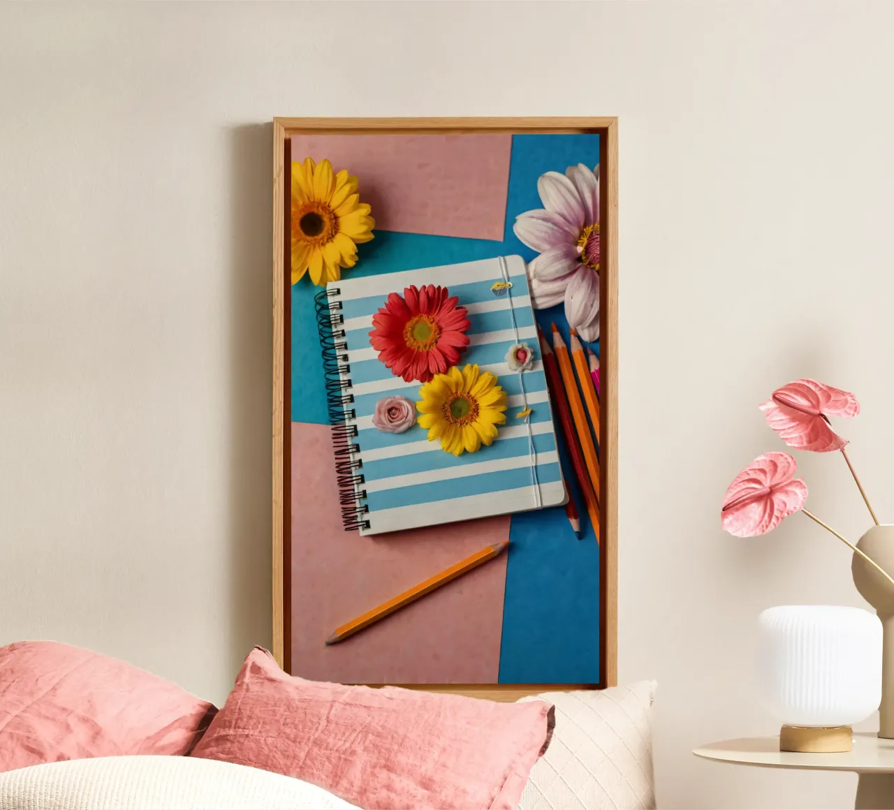 Colorful notebook adorned with flowers surrounded by pencils canvas by DesignDoodle