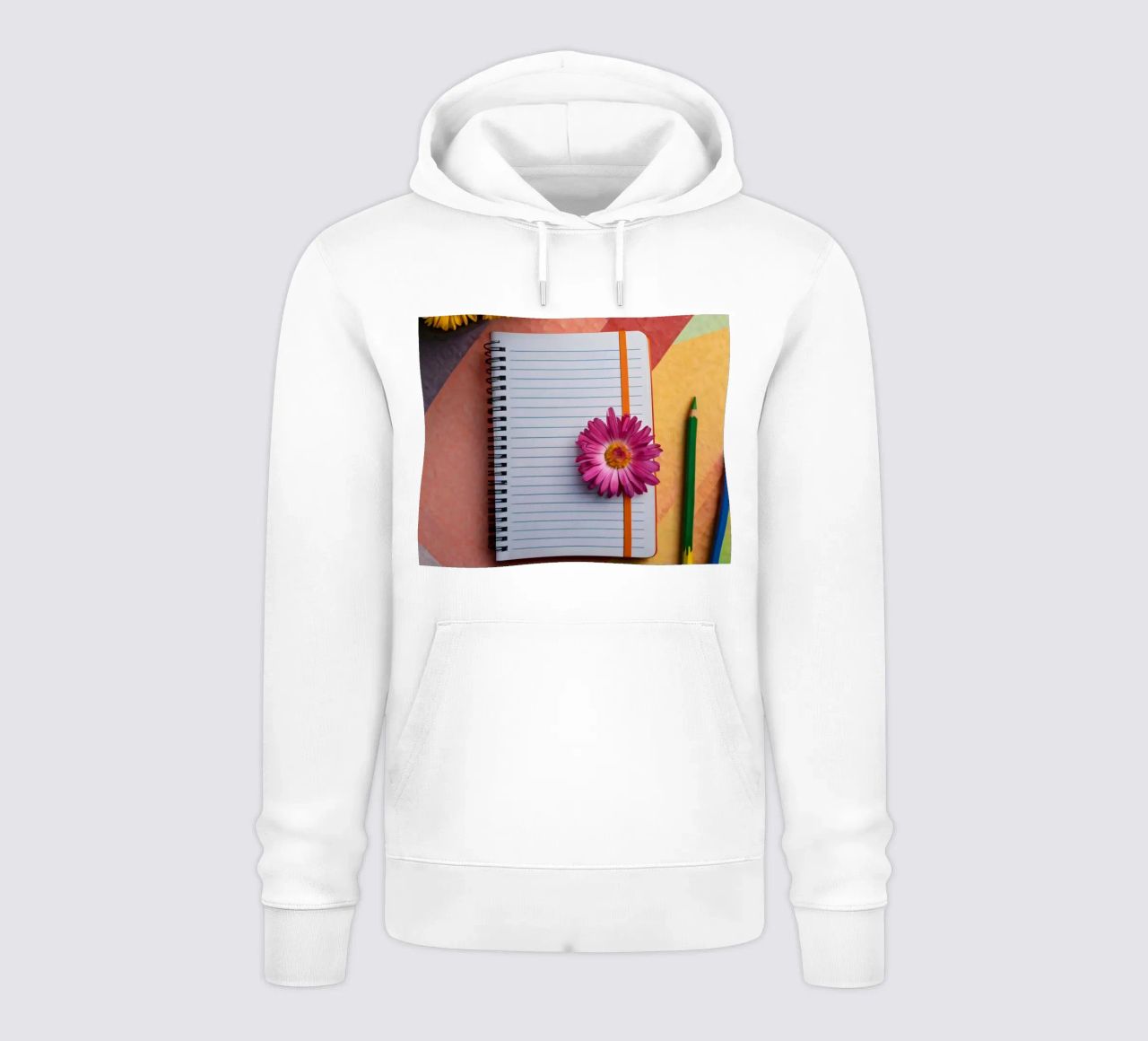 Uno spazio di lavoro colorato con un taccuino con un fiore felpa con cappuccio da DesignDoodle