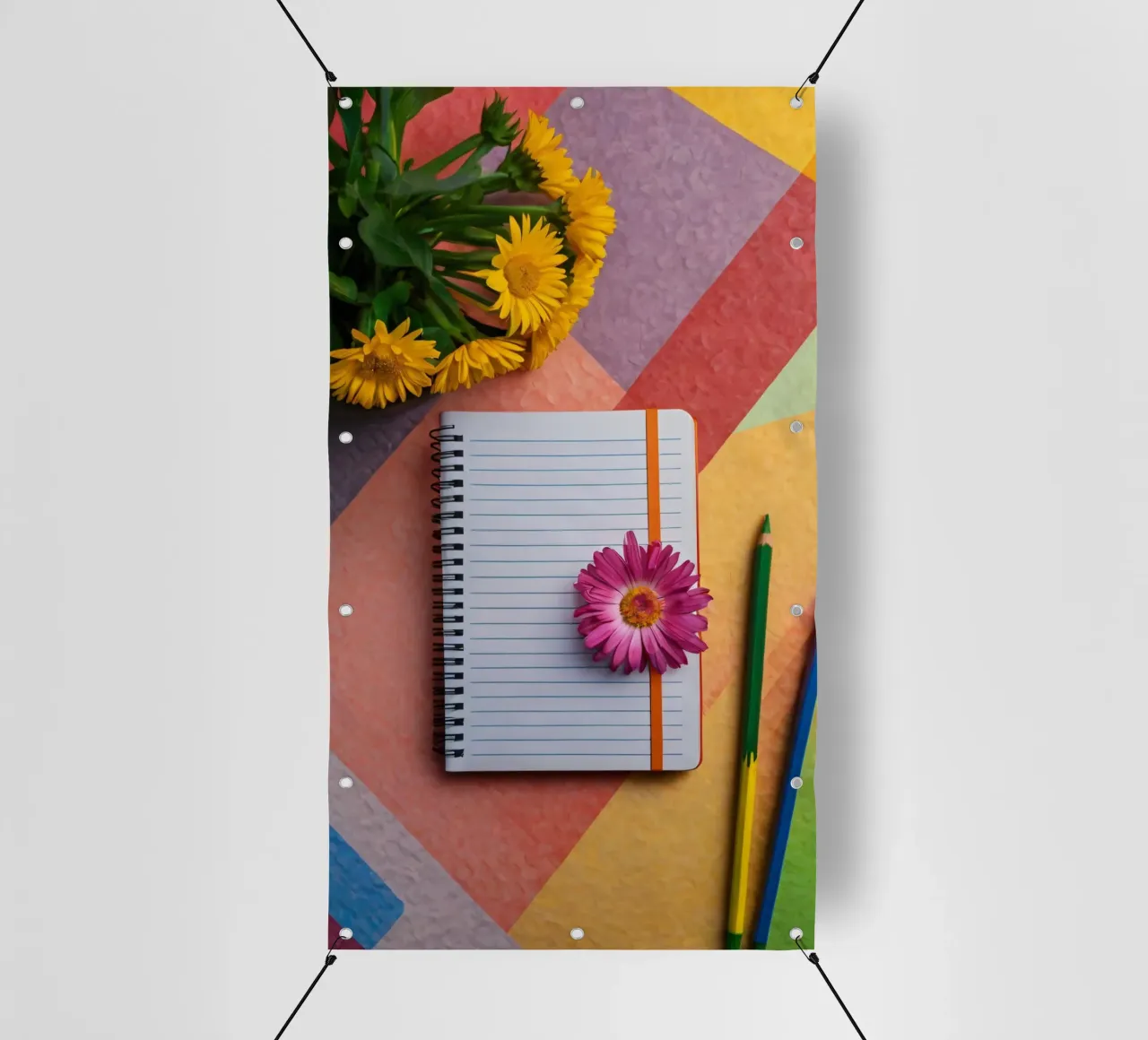 Colorful workspace featuring a notebook with a flower pvc cover by DesignDoodle