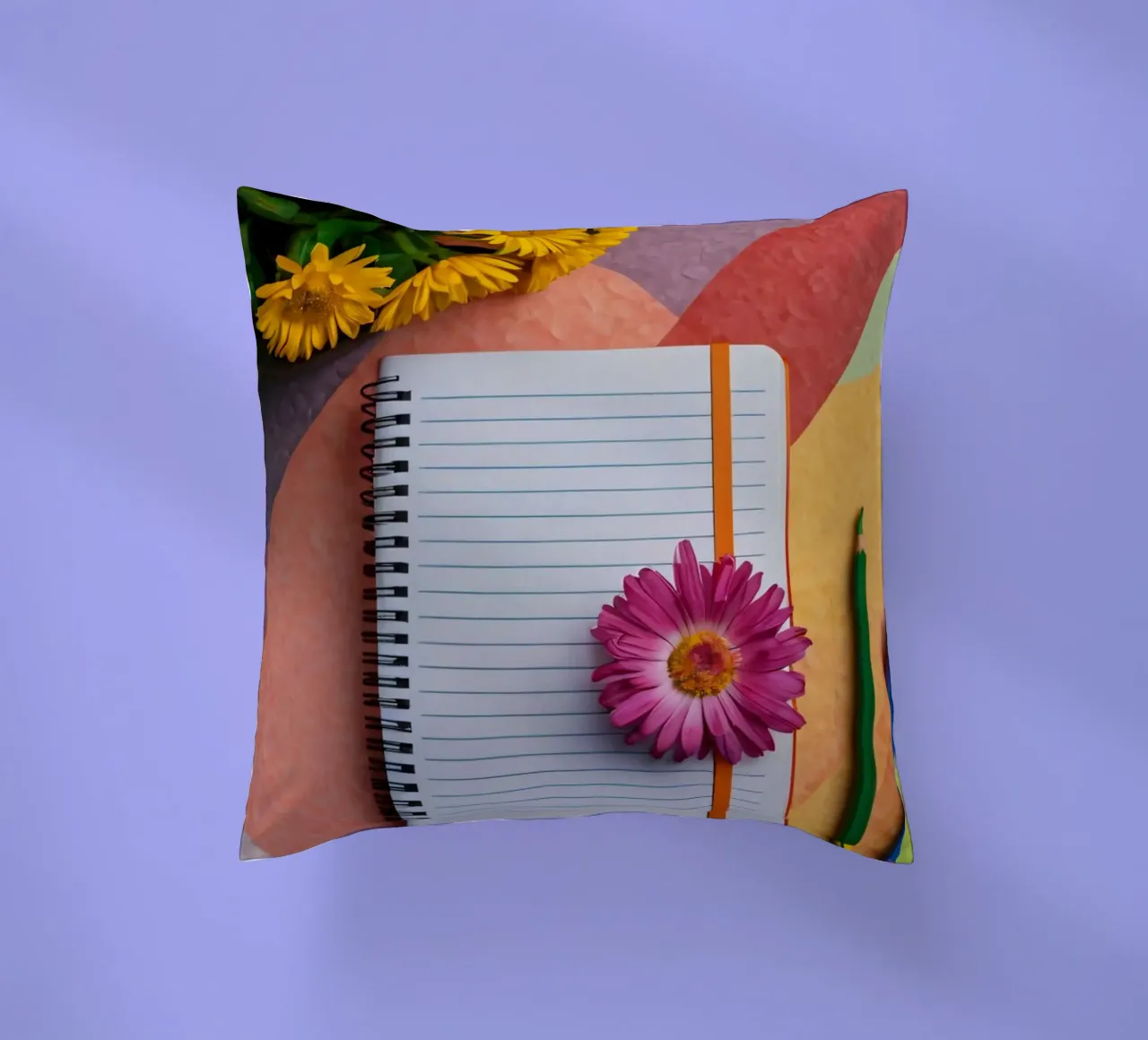 Uno spazio di lavoro colorato con un taccuino con un fiore cuscino da DesignDoodle