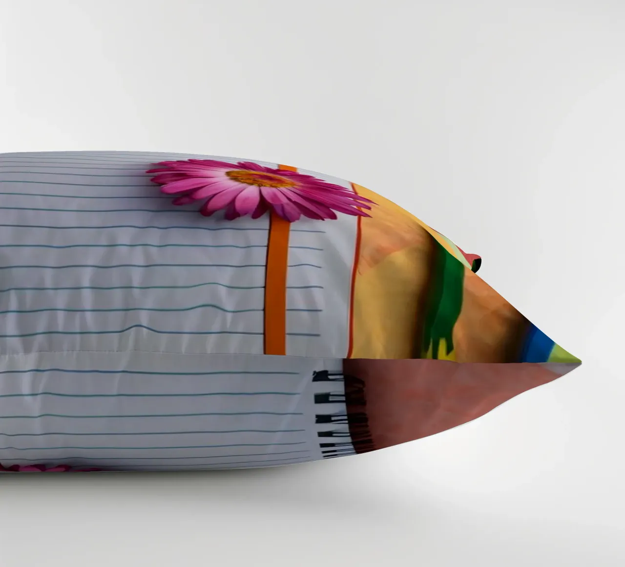 Espace de travail coloré comprenant un cahier avec une fleur coussin de DesignDoodle