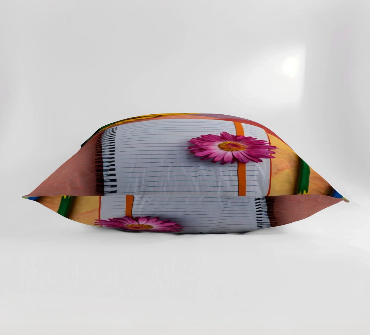 Uno spazio di lavoro colorato con un taccuino con un fiore cuscino da DesignDoodle