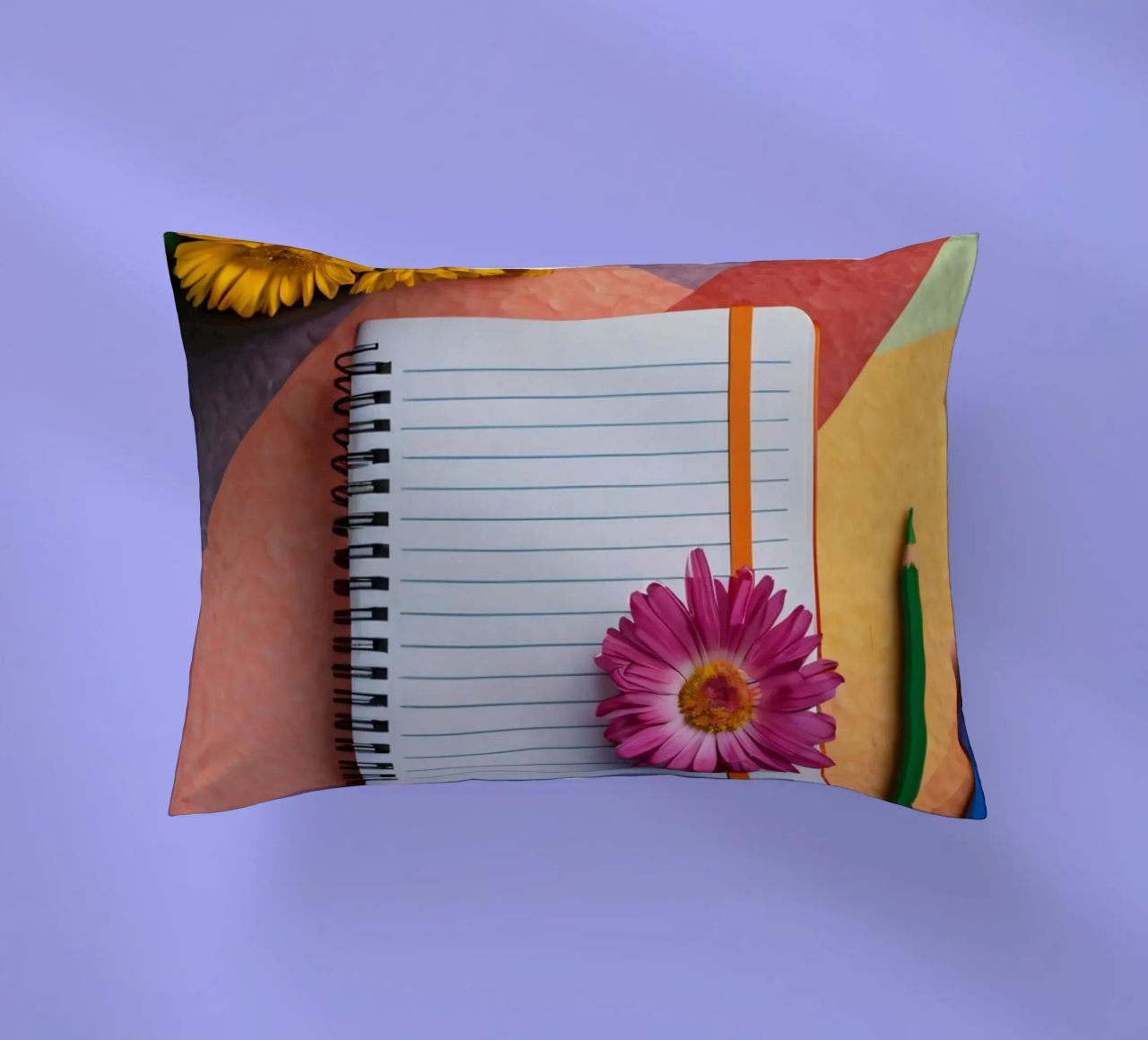 Uno spazio di lavoro colorato con un taccuino con un fiore cuscino da DesignDoodle
