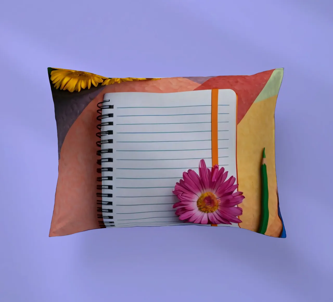 Uno spazio di lavoro colorato con un taccuino con un fiore cuscino da DesignDoodle