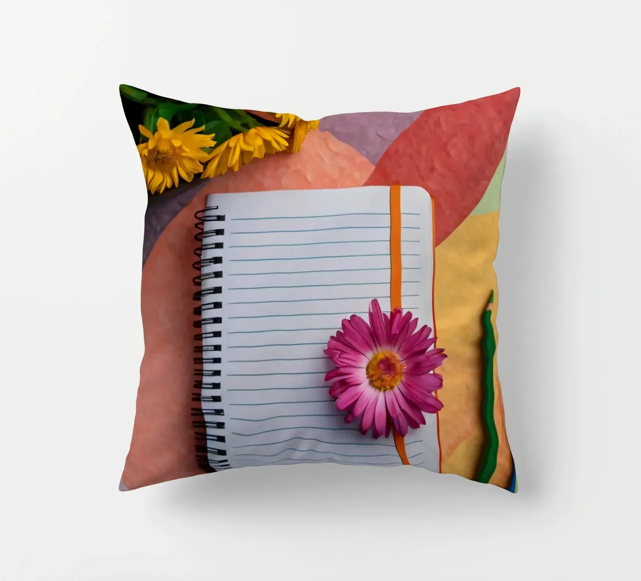 Uno spazio di lavoro colorato con un taccuino con un fiore cuscino da DesignDoodle