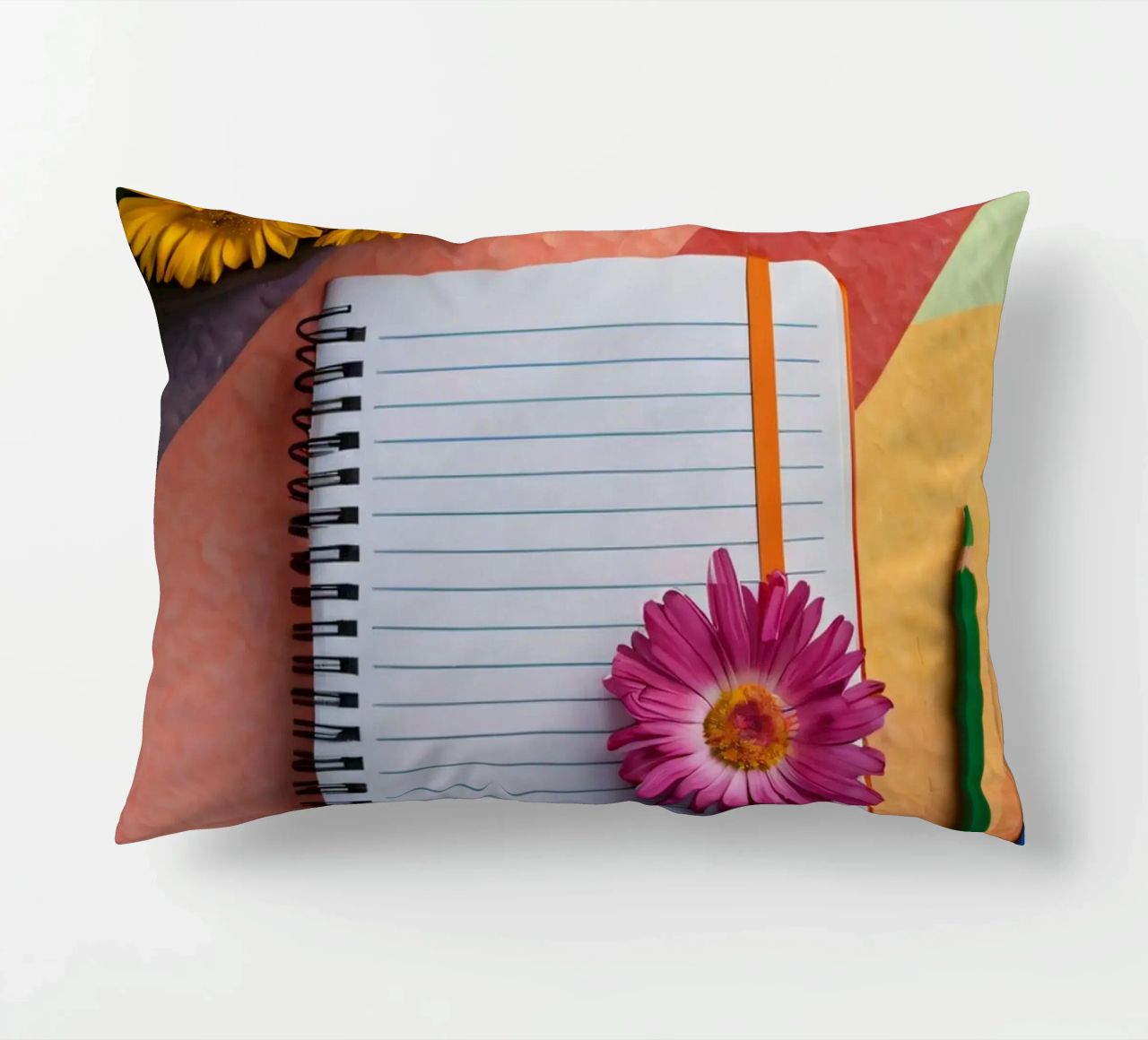 Uno spazio di lavoro colorato con un taccuino con un fiore cuscino da DesignDoodle