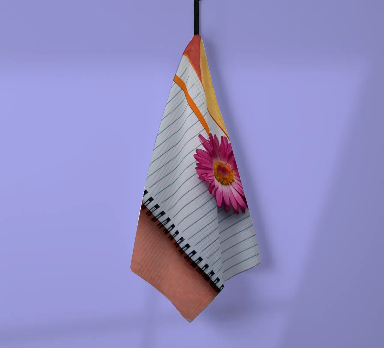 Uno spazio di lavoro colorato con un taccuino con un fiore canovaccio da cucina da DesignDoodle