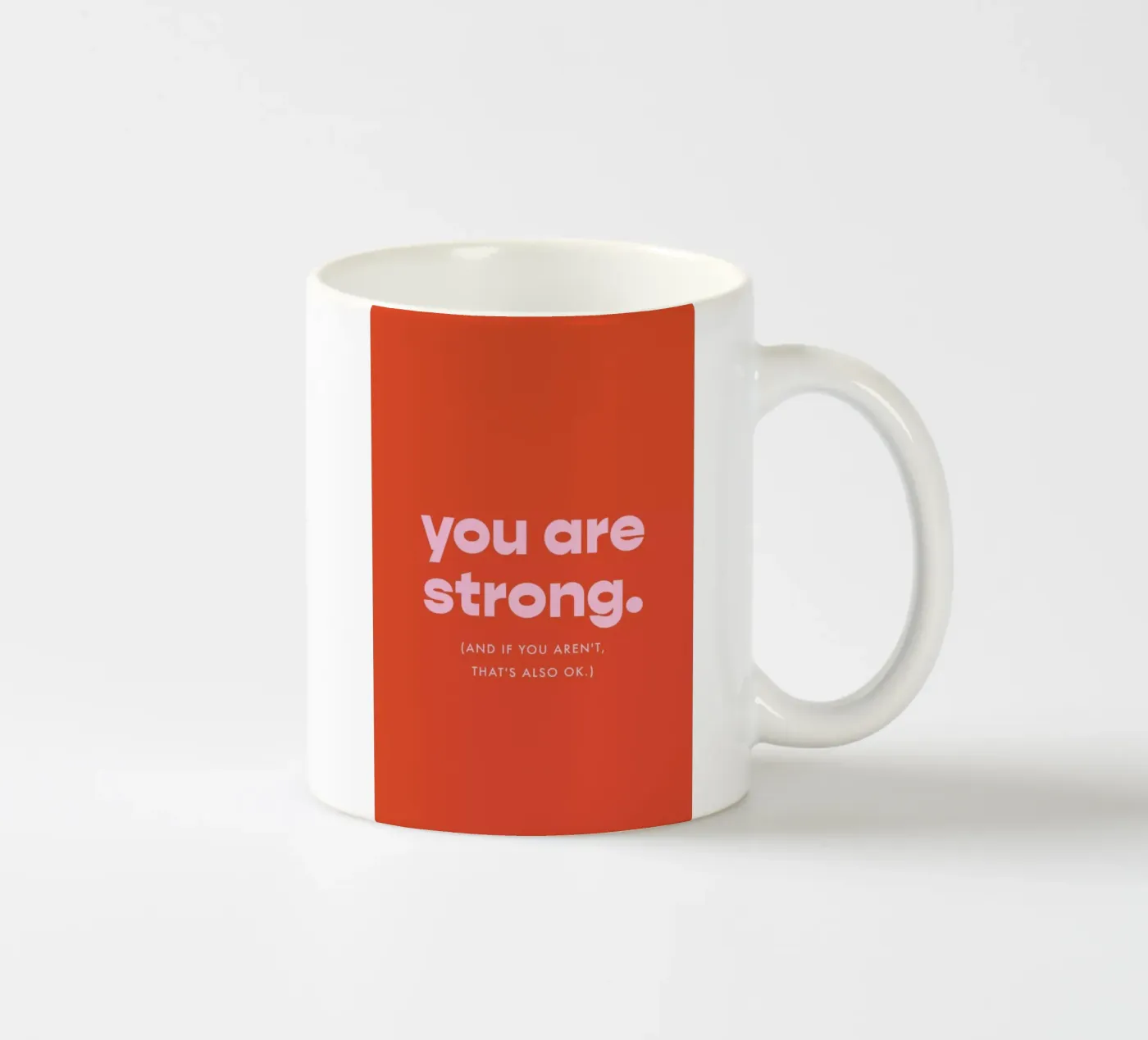 Strength ceramic mug by vonkopfbisfuss x JUNIQE