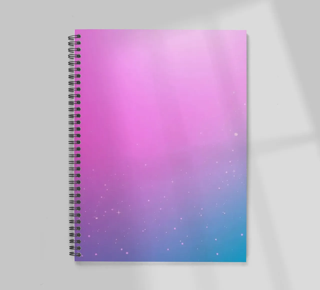 arrière-plan avec des couleurs dégradées et des éléments scintillants carnet à spirale de DesignDoodle