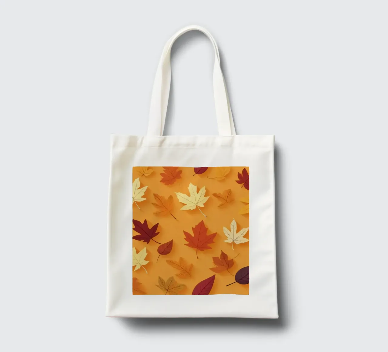 Colorful autumn leaves scattered, vibrant orange backdrop tote bag by DesignDoodle