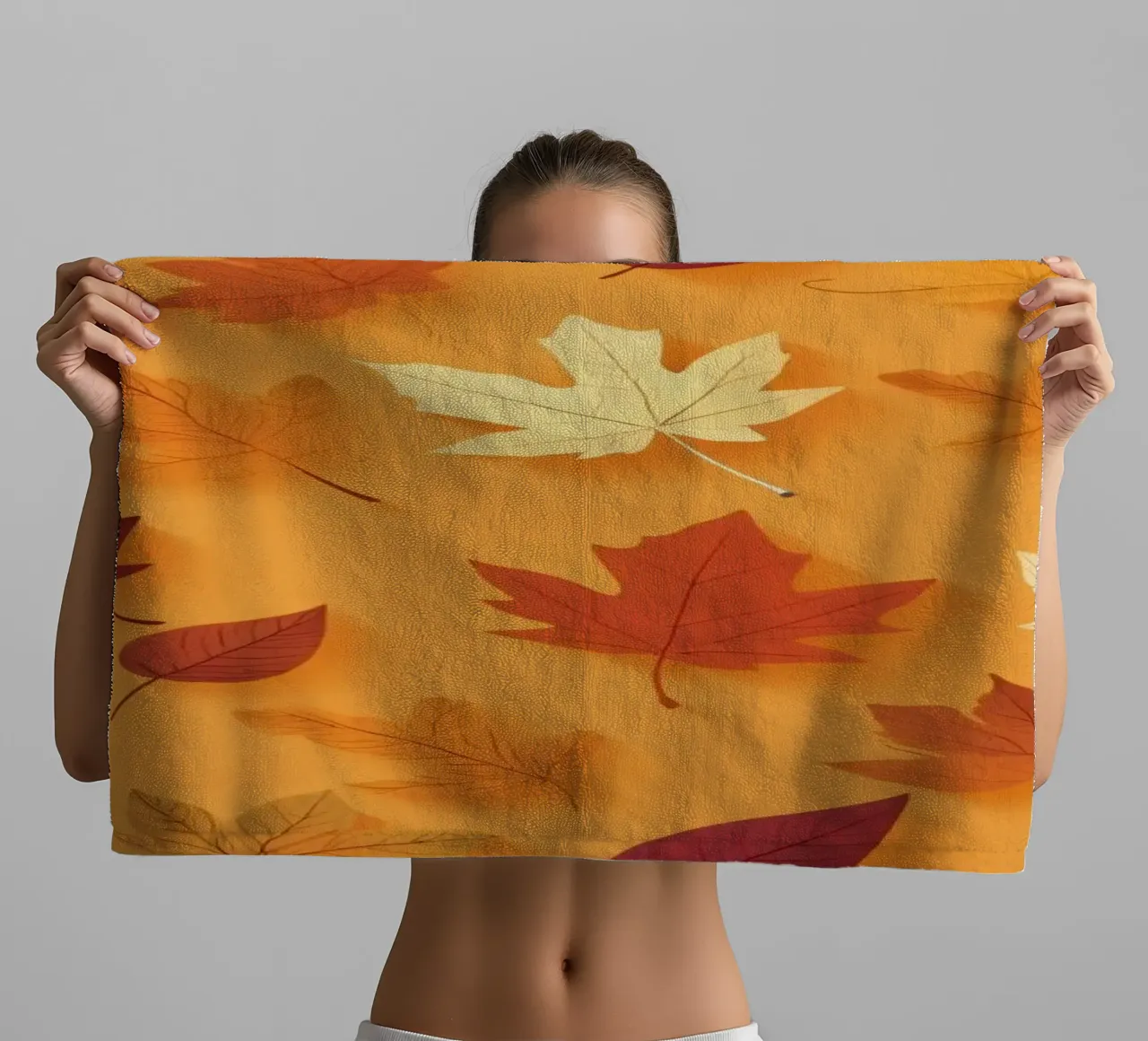 Colorful autumn leaves scattered, vibrant orange backdrop towel by DesignDoodle