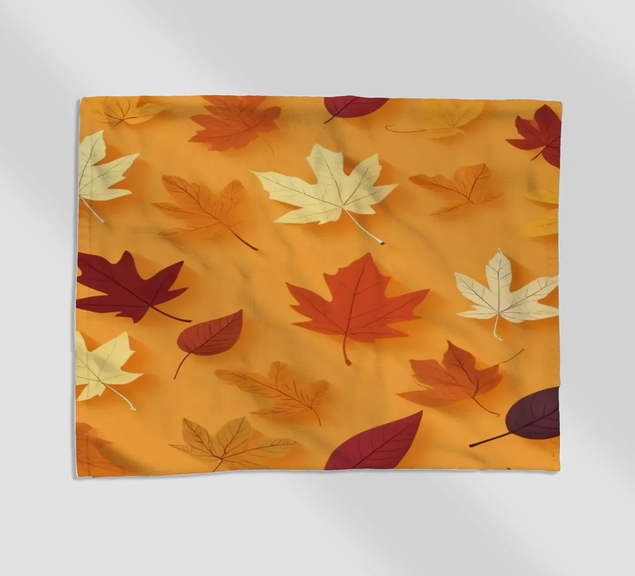Colorful autumn leaves scattered, vibrant orange backdrop beach towel by DesignDoodle