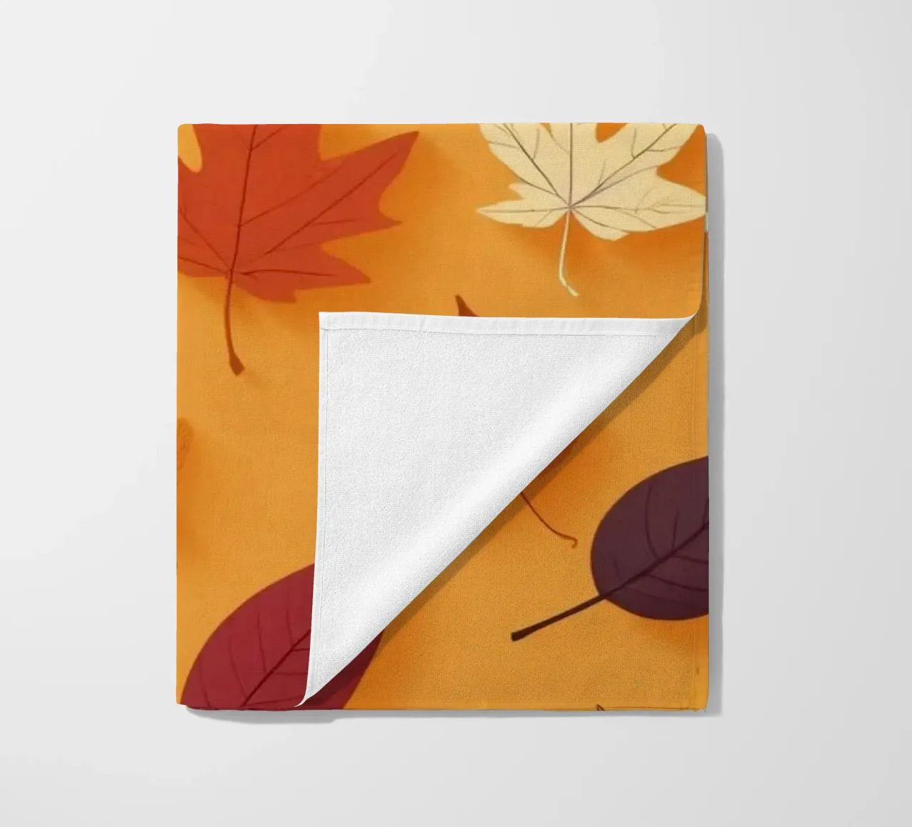Colorful autumn leaves scattered, vibrant orange backdrop beach towel by DesignDoodle