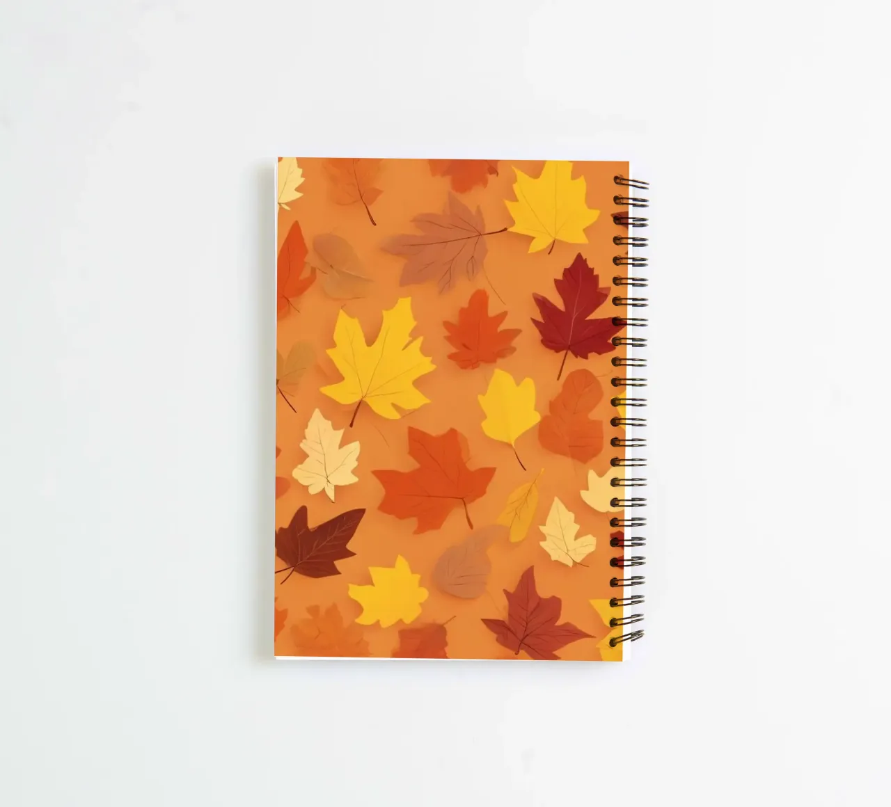 autumn leaves create an abstract background design spiral notebook by DesignDoodle