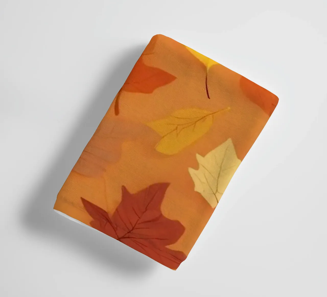 autumn leaves create an abstract background design towel by DesignDoodle