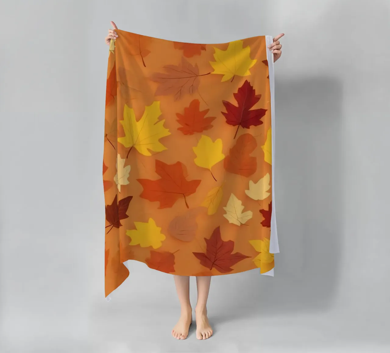 autumn leaves create an abstract background design beach towel by DesignDoodle