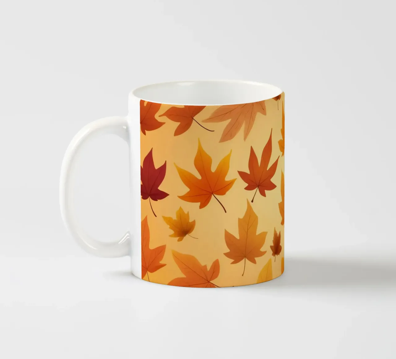 autumn leaves in warm hues creating an abstract background ceramic mug by DesignDoodle