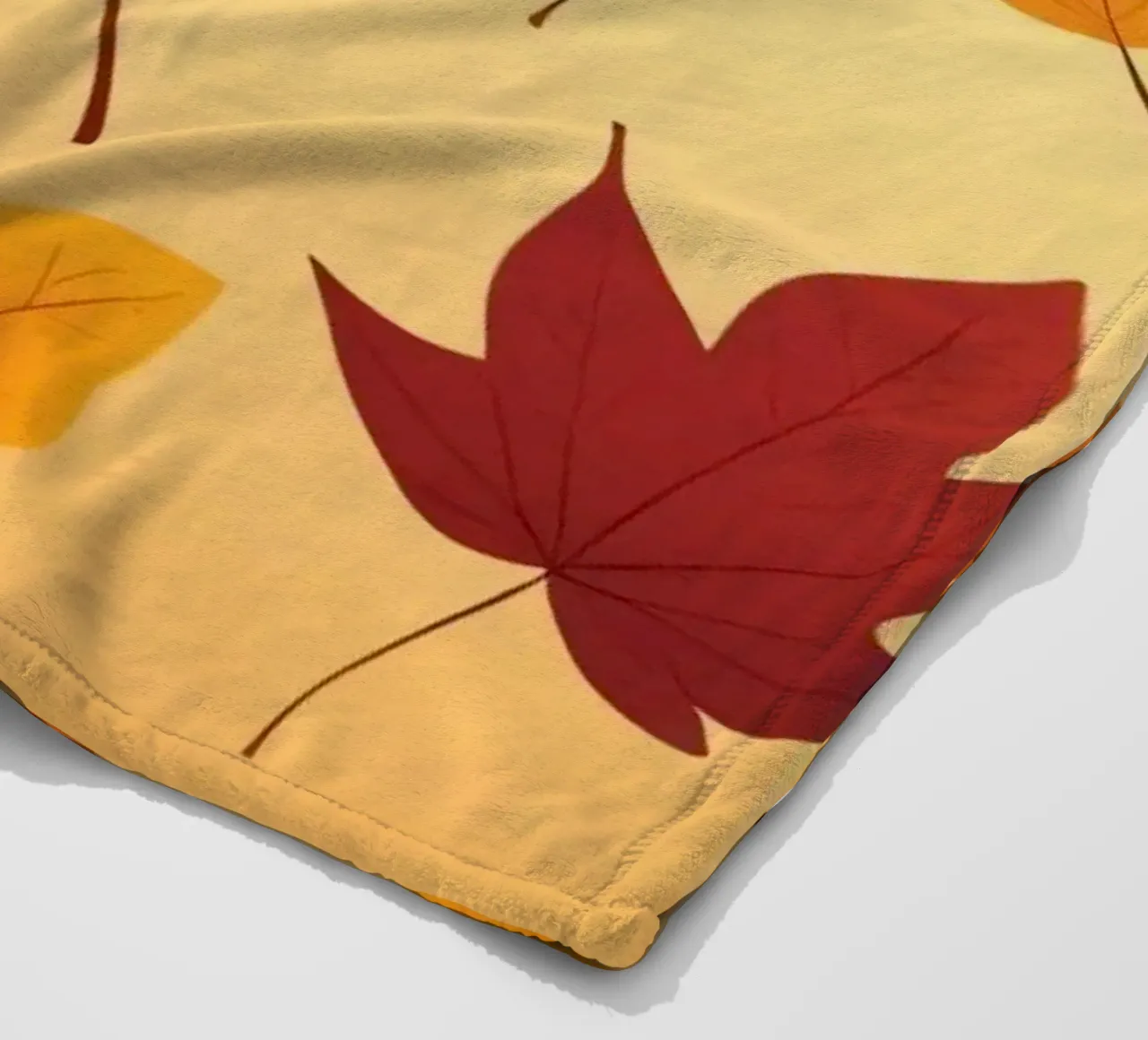 autumn leaves in warm hues creating an abstract background fleece blanket by DesignDoodle