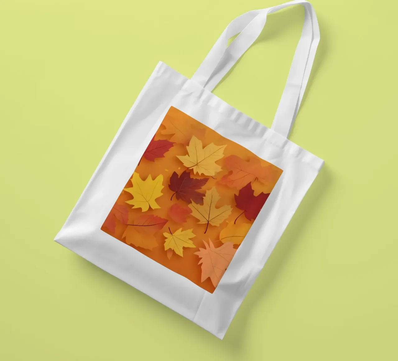 autumn leaves forming an abstract pattern on a warm orange tote bag by DesignDoodle