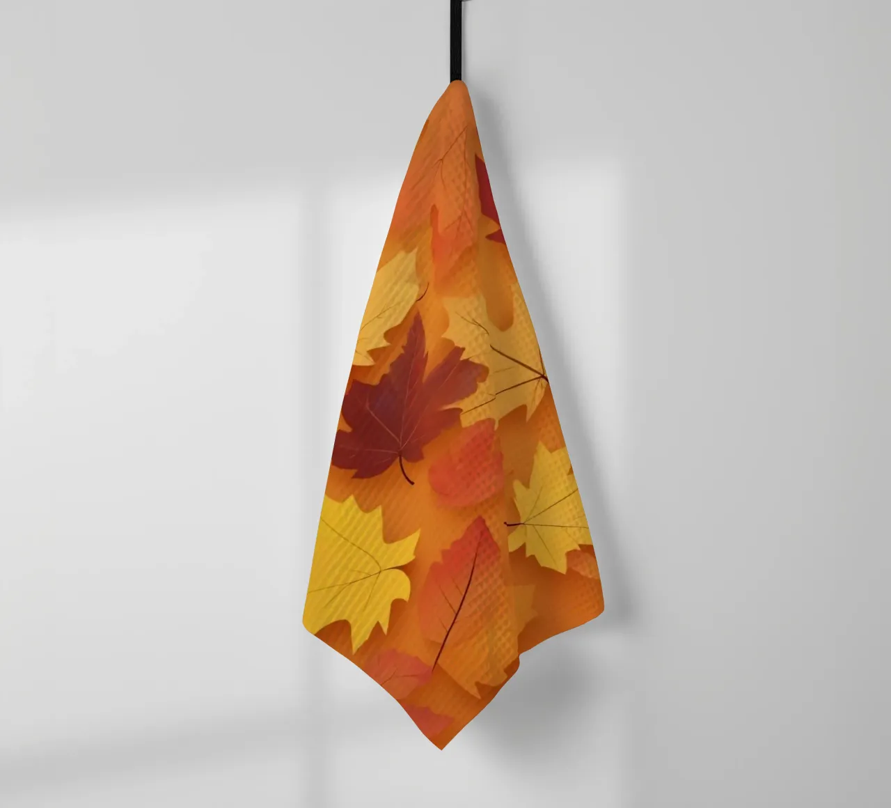 feuilles d'automne formant un motif abstrait sur un orange chaud torchon de DesignDoodle