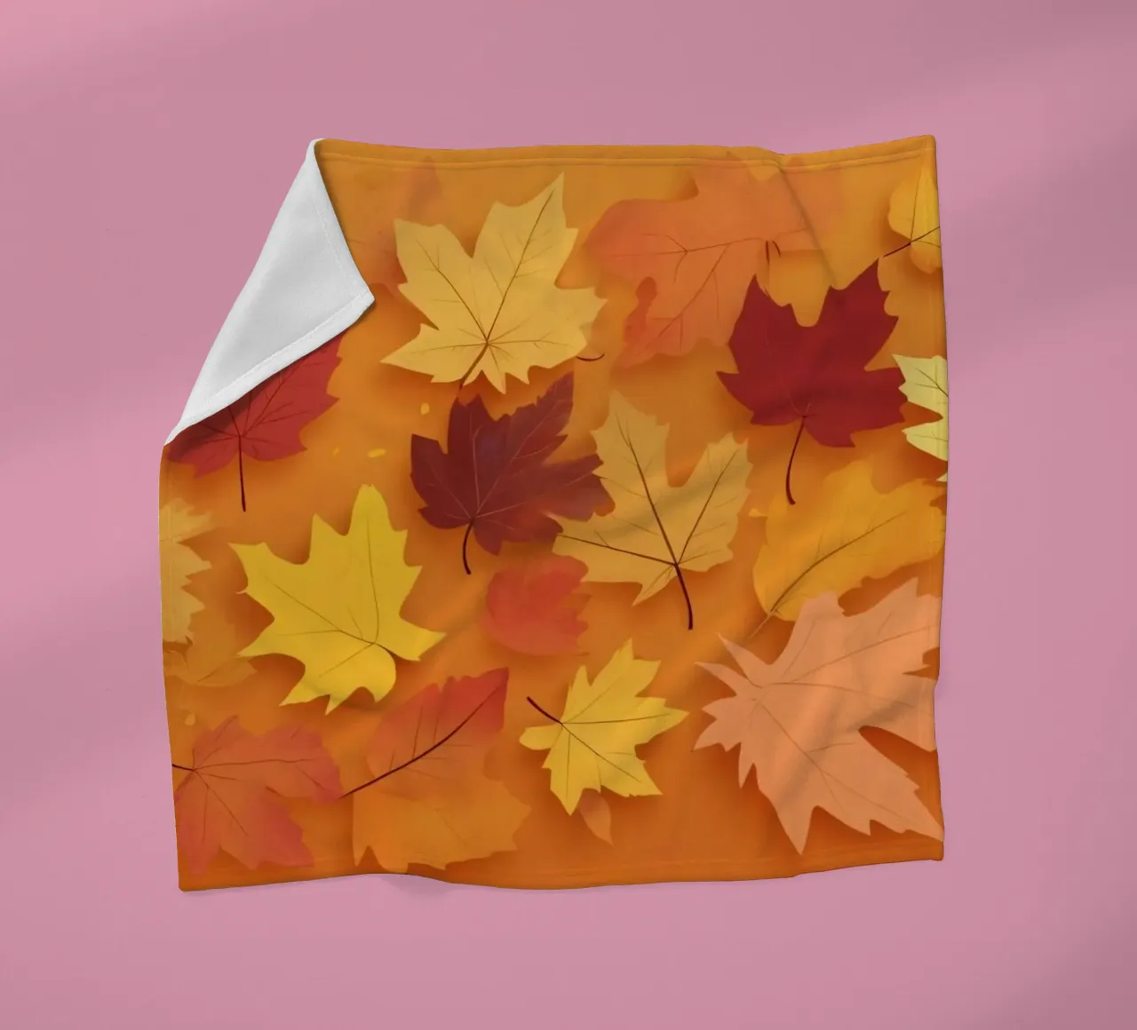 autumn leaves forming an abstract pattern on a warm orange fleece blanket by DesignDoodle