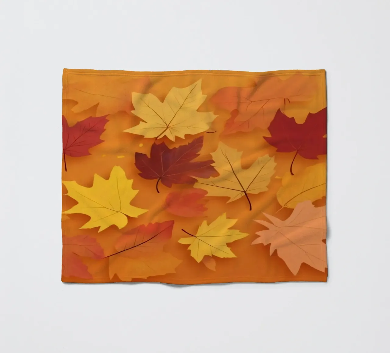 autumn leaves forming an abstract pattern on a warm orange fleece blanket by DesignDoodle