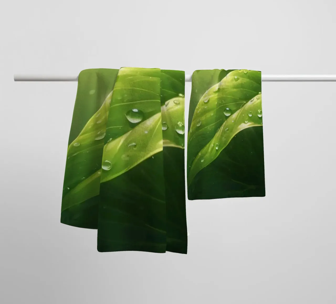 Lush greenery with sparkling droplet illuminated by sunlight towel by DesignDoodle