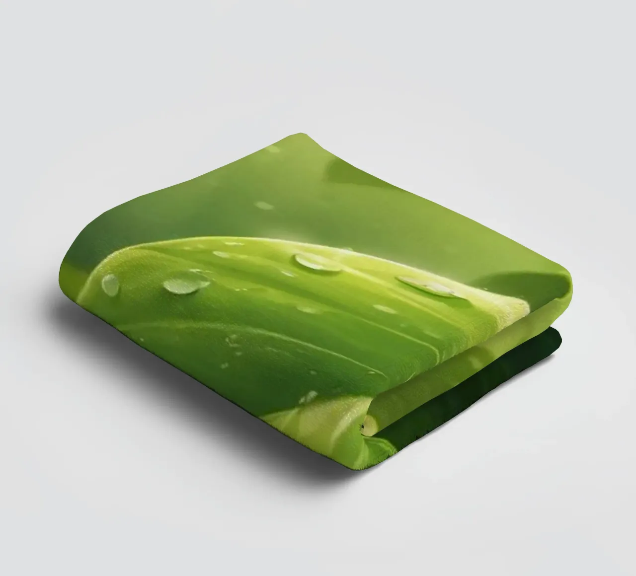 Lush greenery with sparkling droplet illuminated by sunlight towel by DesignDoodle