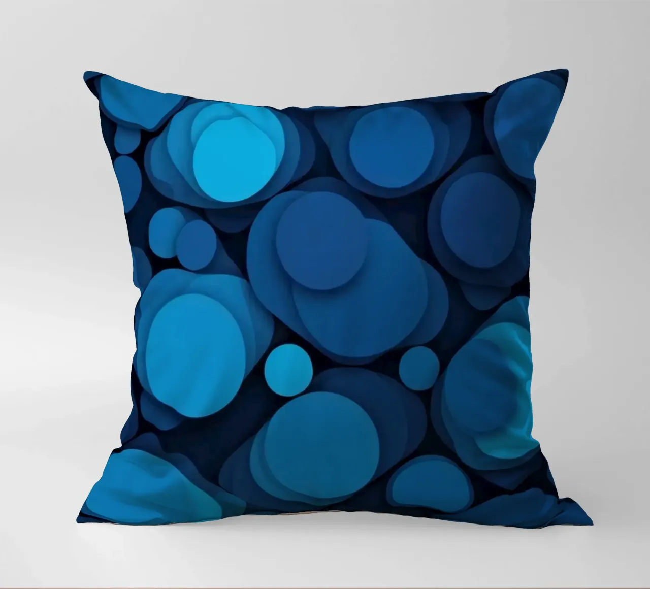 abstract design featuring layered blue circles decorative cushion by DesignDoodle