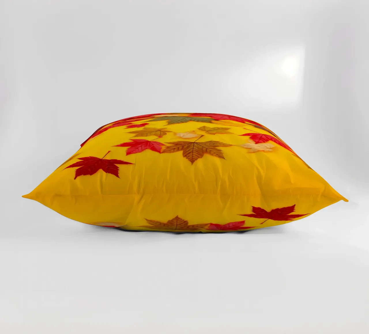 foglie autunnali sparse su uno sfondo giallo caldo cuscino da DesignDoodle