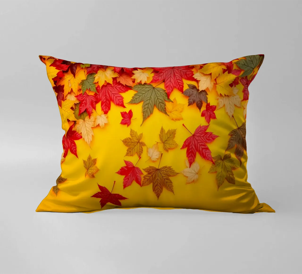 foglie autunnali sparse su uno sfondo giallo caldo cuscino da DesignDoodle
