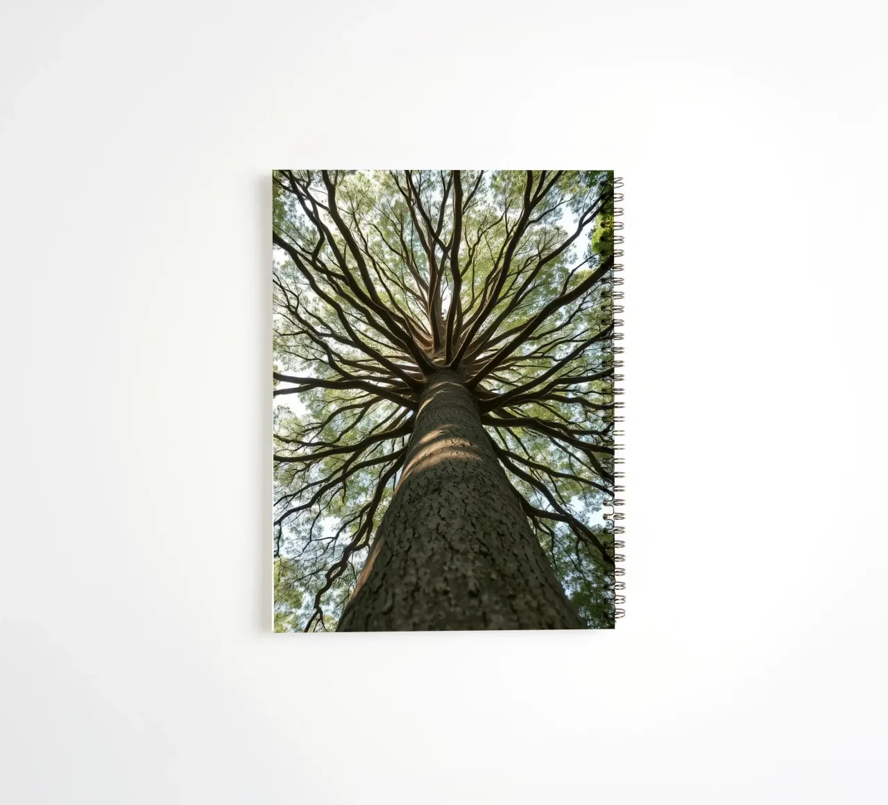 Majestic tree towering over the forest with sprawling branch spiral notebook by DesignDoodle