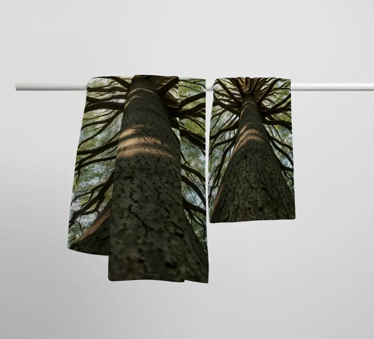 Majestic tree towering over the forest with sprawling branch towel by DesignDoodle