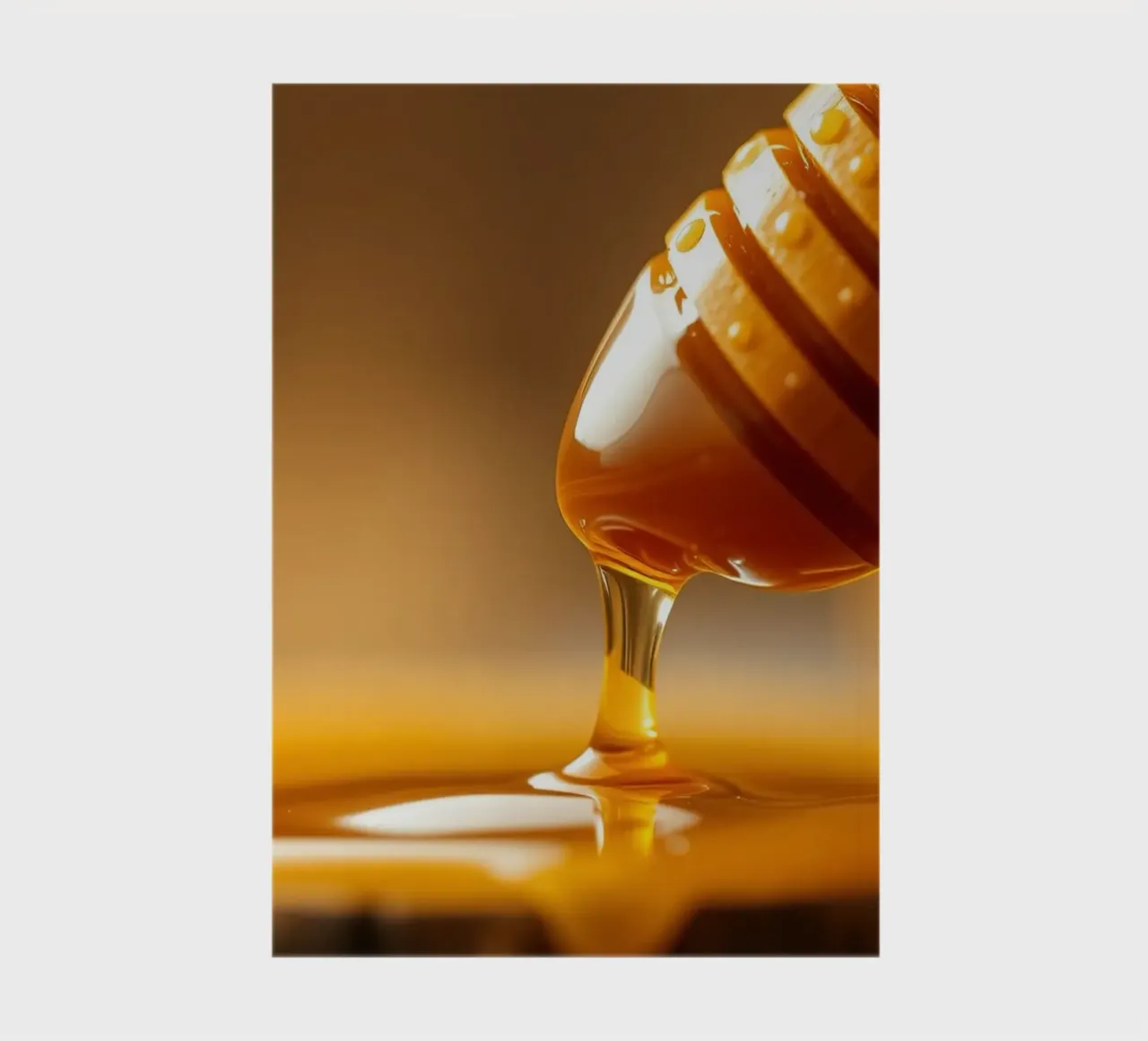 Golden honey drips from a wooden dipper on a rustic wooden notebook by DesignDoodle