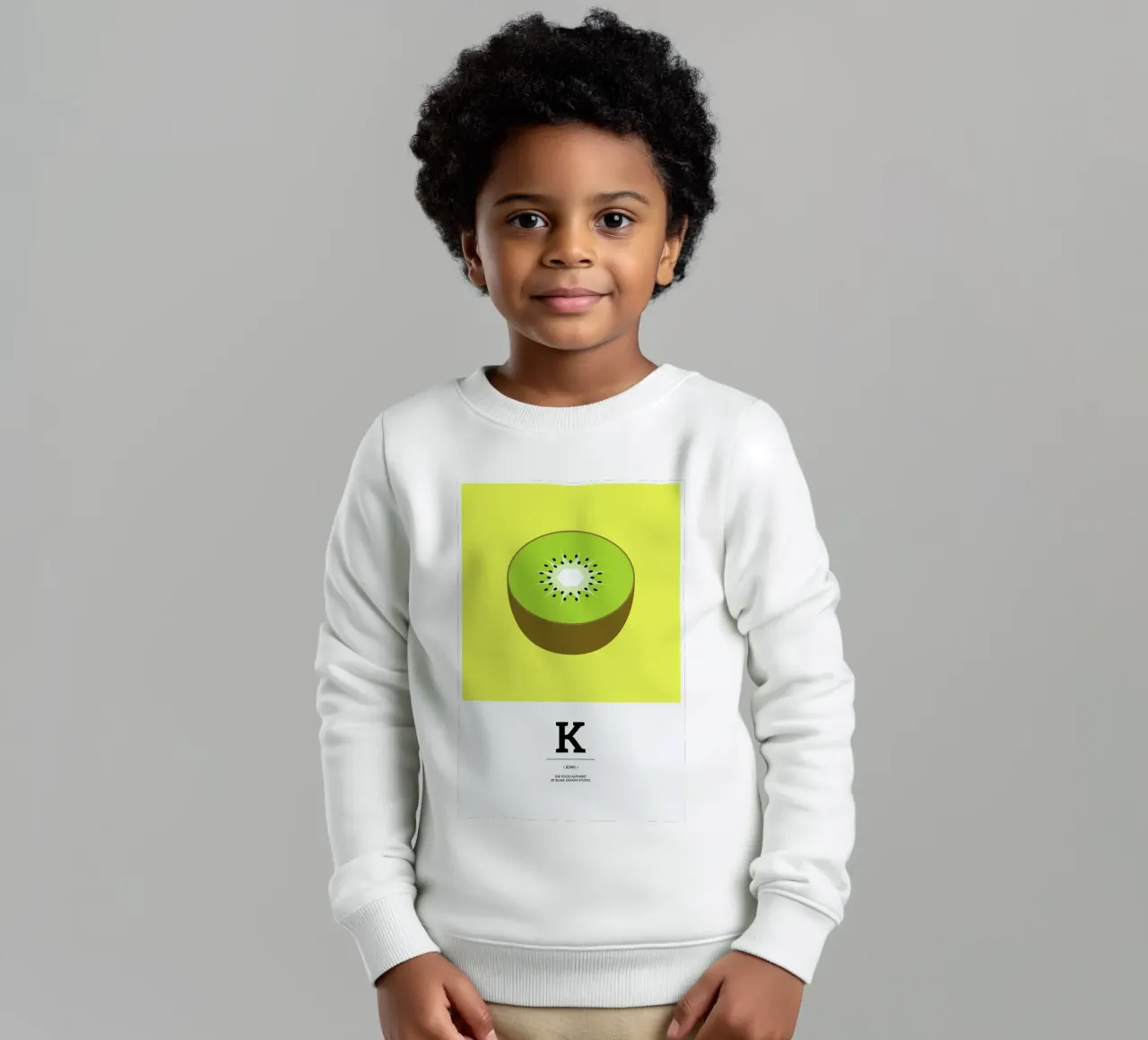 „The Food Alphabet“ - K like Kiwi felpa bambino da BLAEK Design Studio