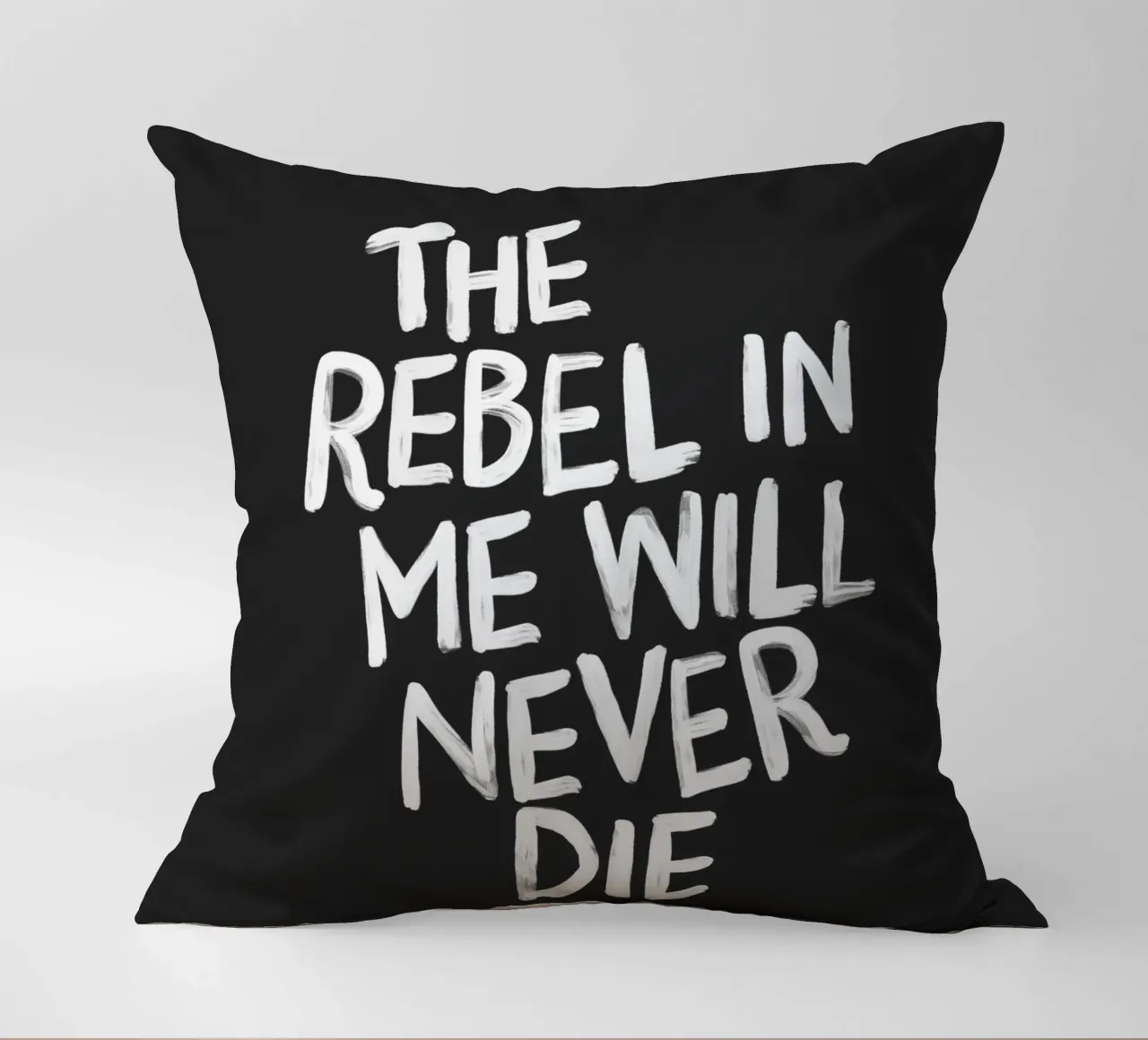 The Rebel in Me Will Never Die Black Typography Print decorative cushion by THE MOTIVATED TYPE