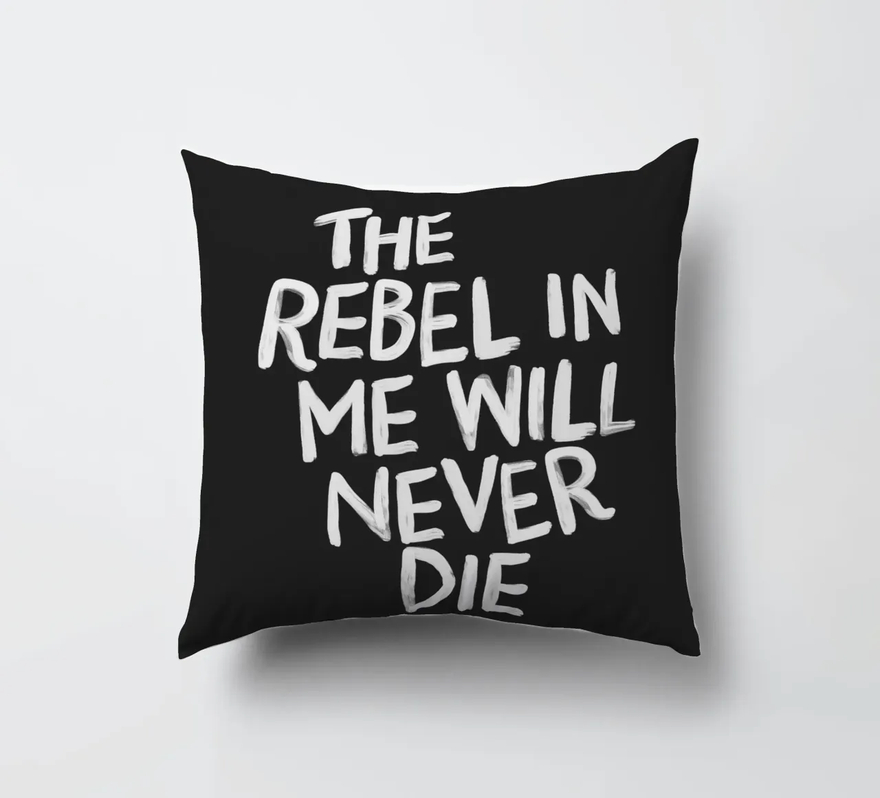 The Rebel in Me Will Never Die Black Typography Print decorative cushion by THE MOTIVATED TYPE