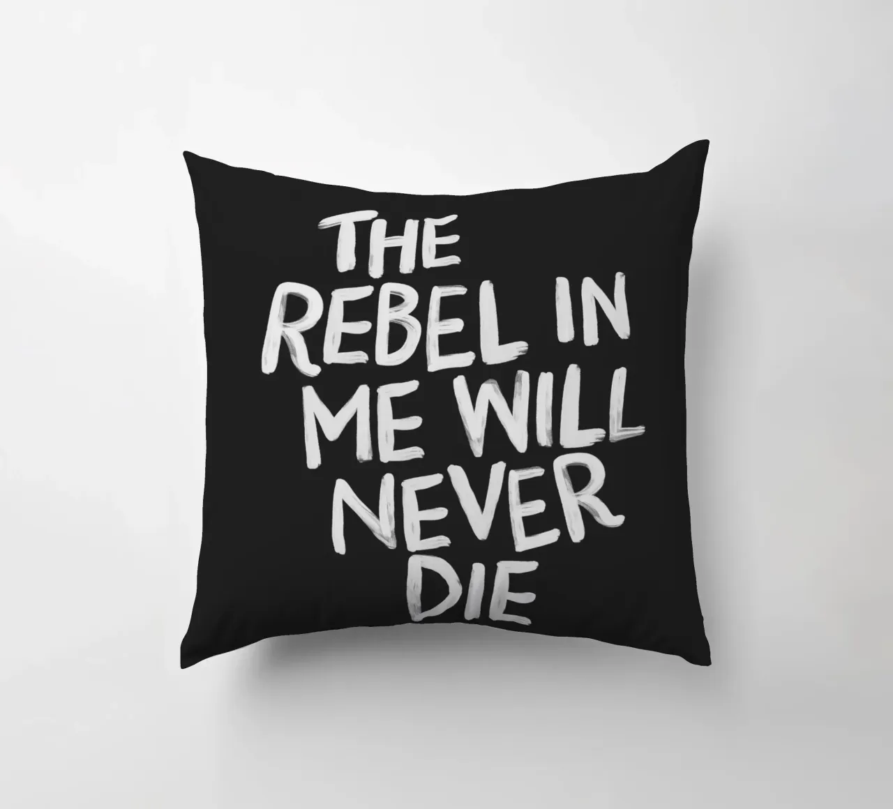 The Rebel in Me Will Never Die Black Typography Print decorative cushion by THE MOTIVATED TYPE