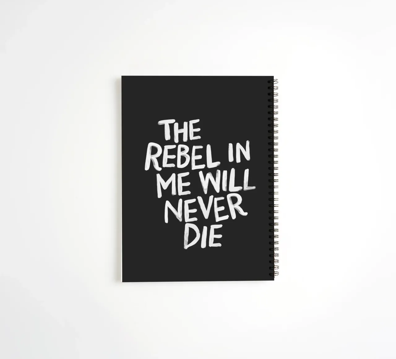 The Rebel in Me Will Never Die Black Typography Print spiral notebook by THE MOTIVATED TYPE