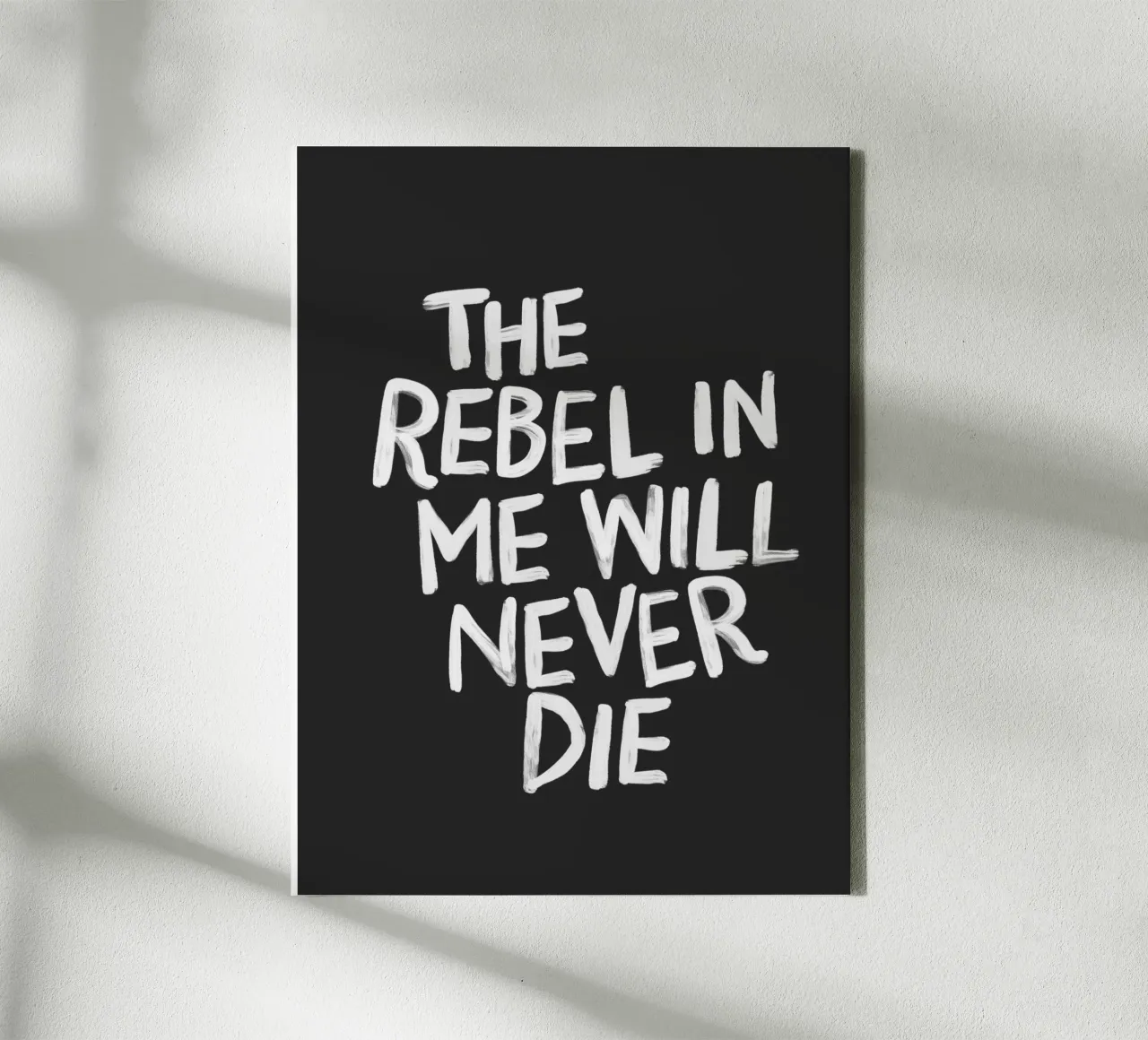 The Rebel in Me Will Never Die Black Typography Print canvas with Floater frame by THE MOTIVATED TYPE