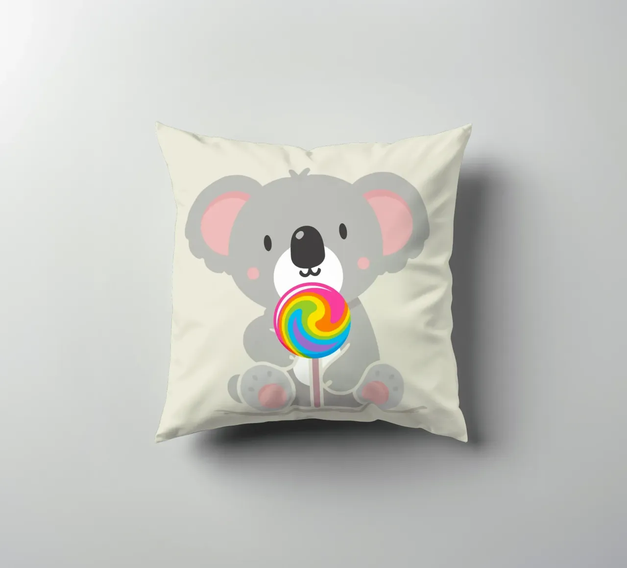 Piccolo koala allegro con un lecca-lecca colorato cuscino da namosh
