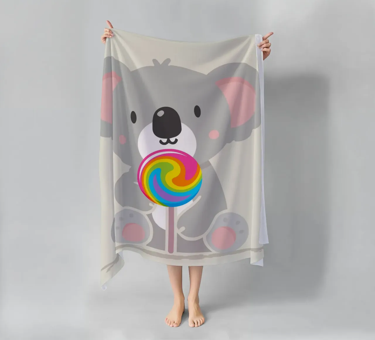 Piccolo koala allegro con un lecca-lecca colorato telo mare da namosh