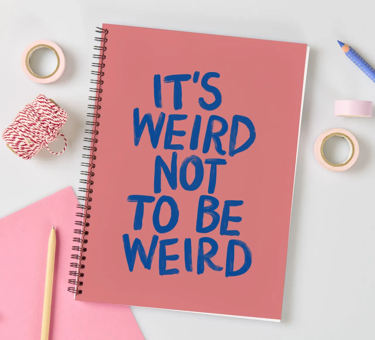 It's Weird Not to Be Weird Pink and Blue Typography Print spiral notebook by THE MOTIVATED TYPE