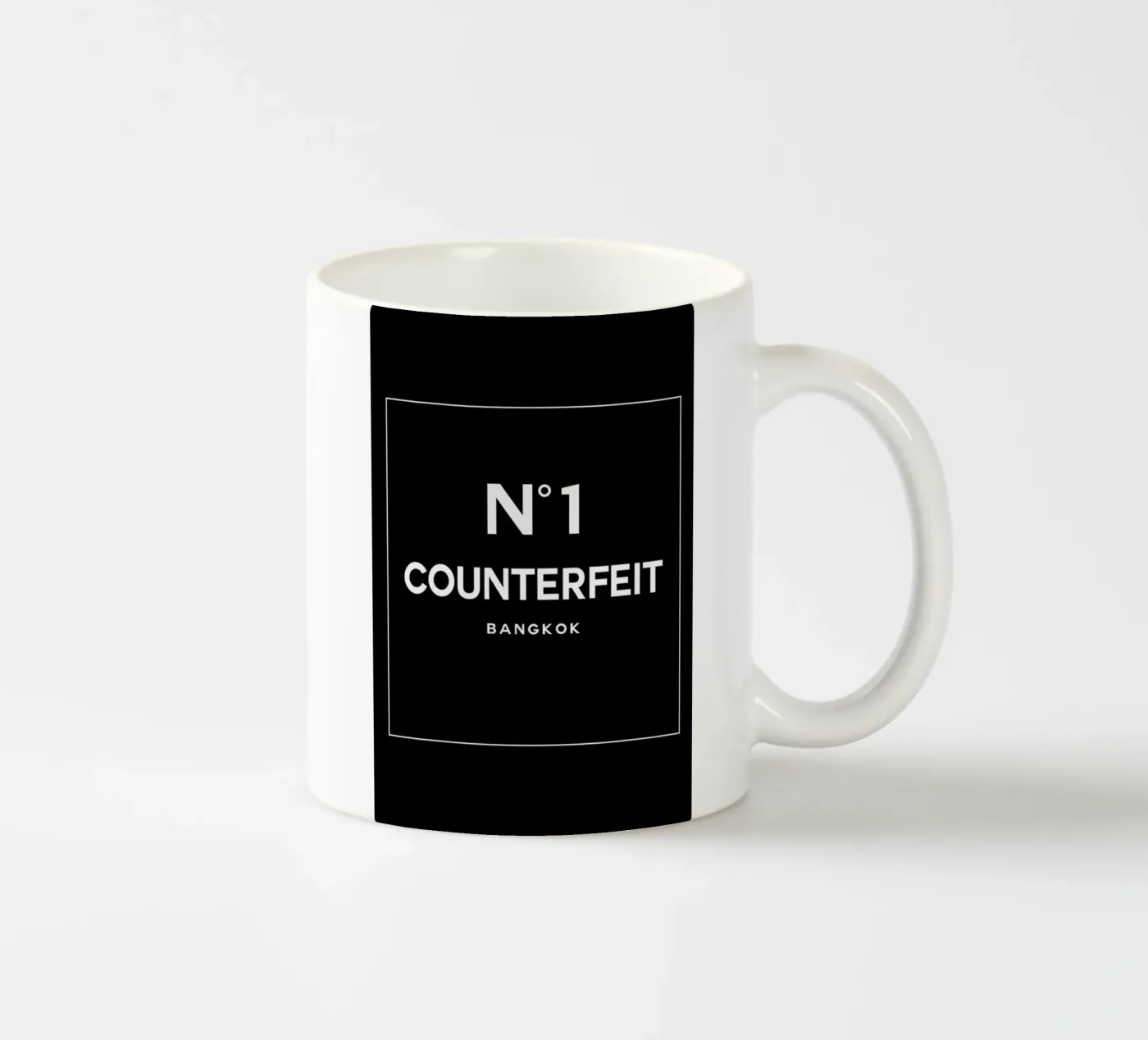 Counterfeit ceramic mug by 121 Creatives