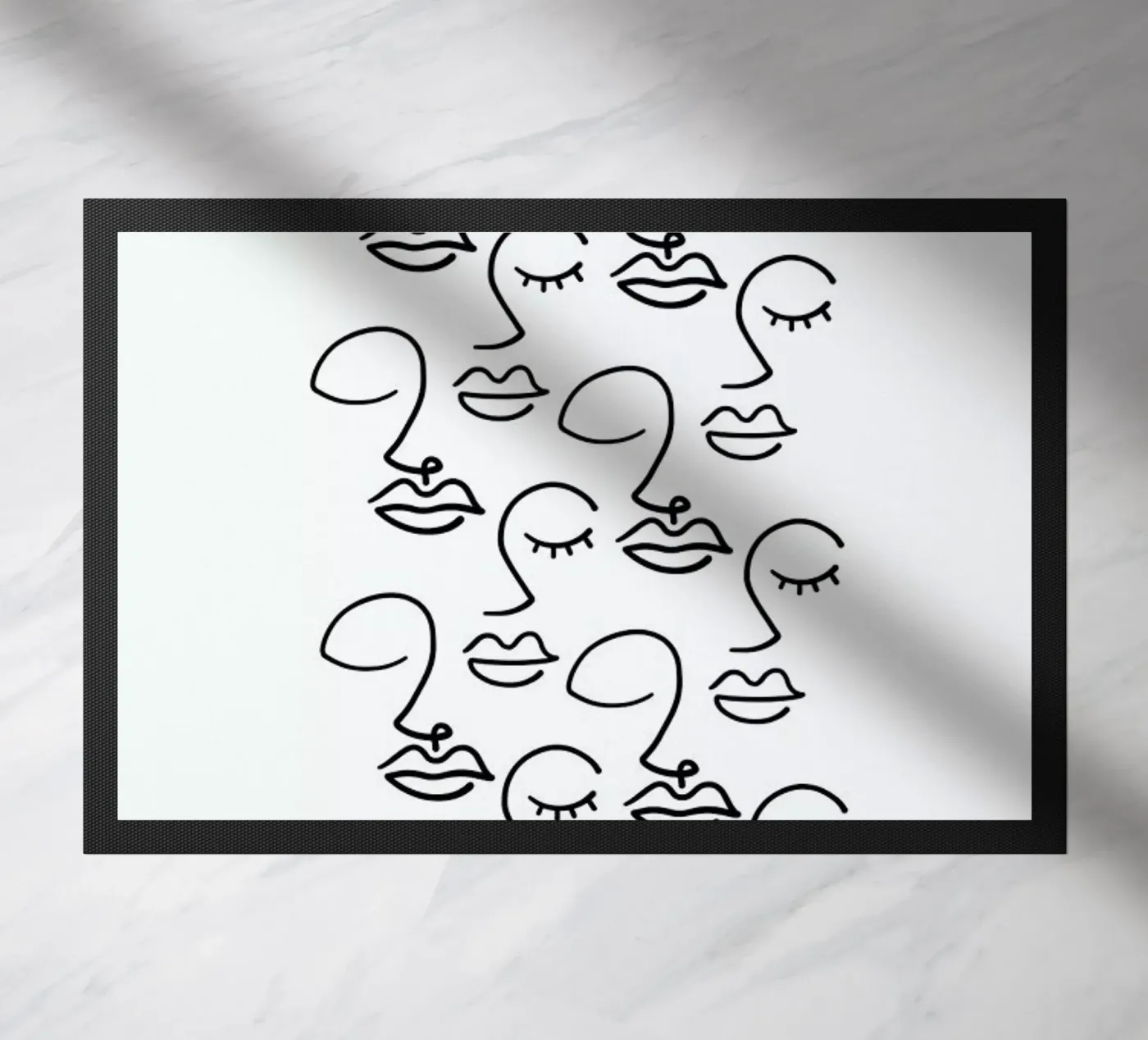 Faces doormat by Ninhol